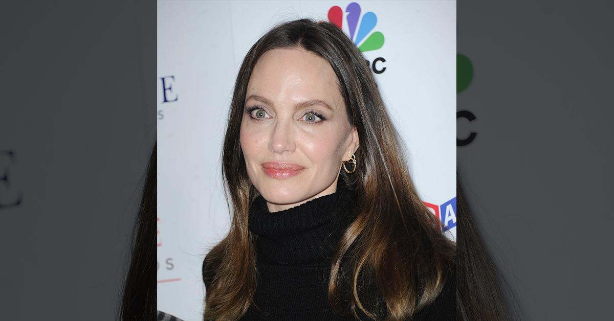 Angelina Jolie showers twins Vivienne and Knox with kisses and