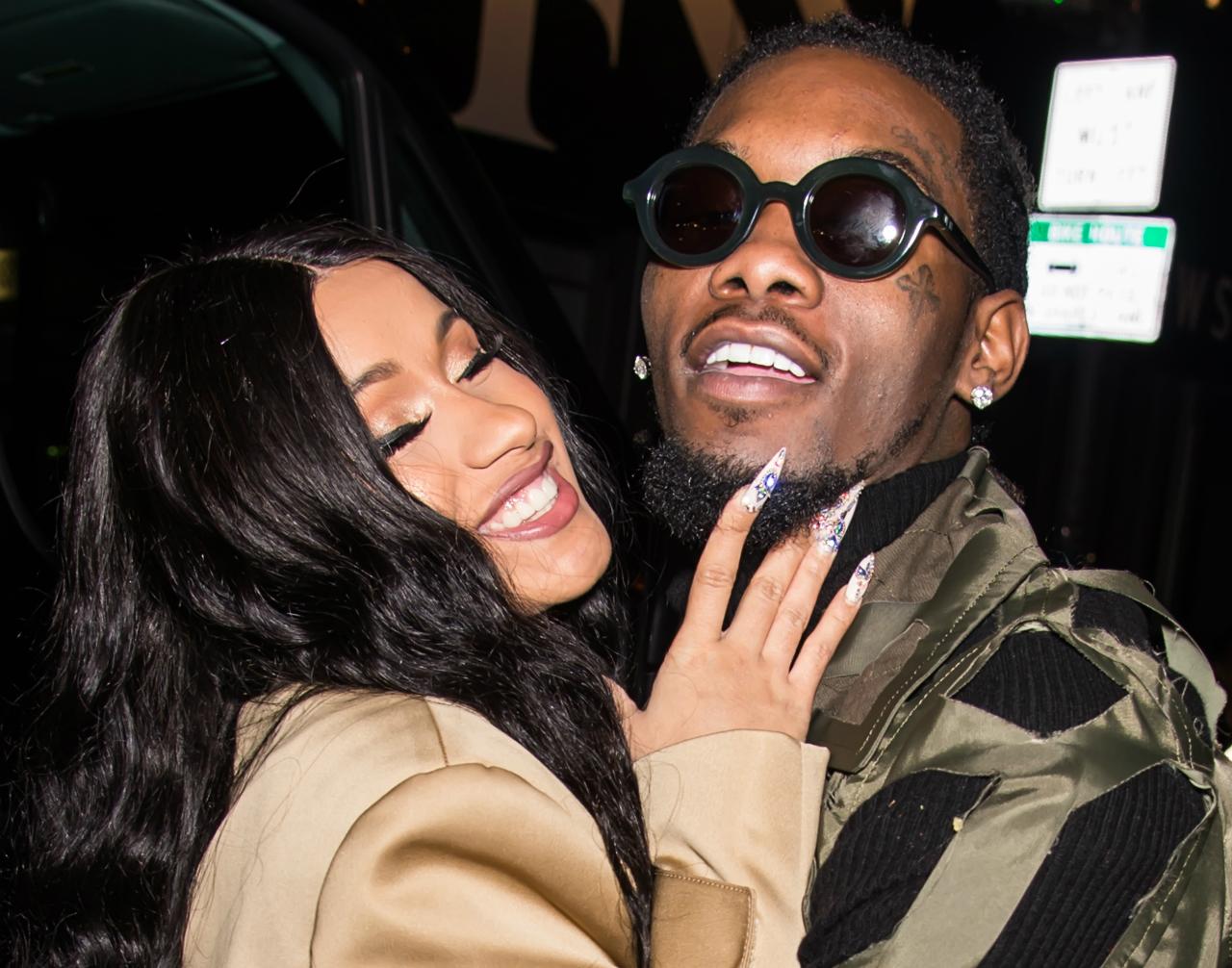 Cardi B and Offset smiling and hugging