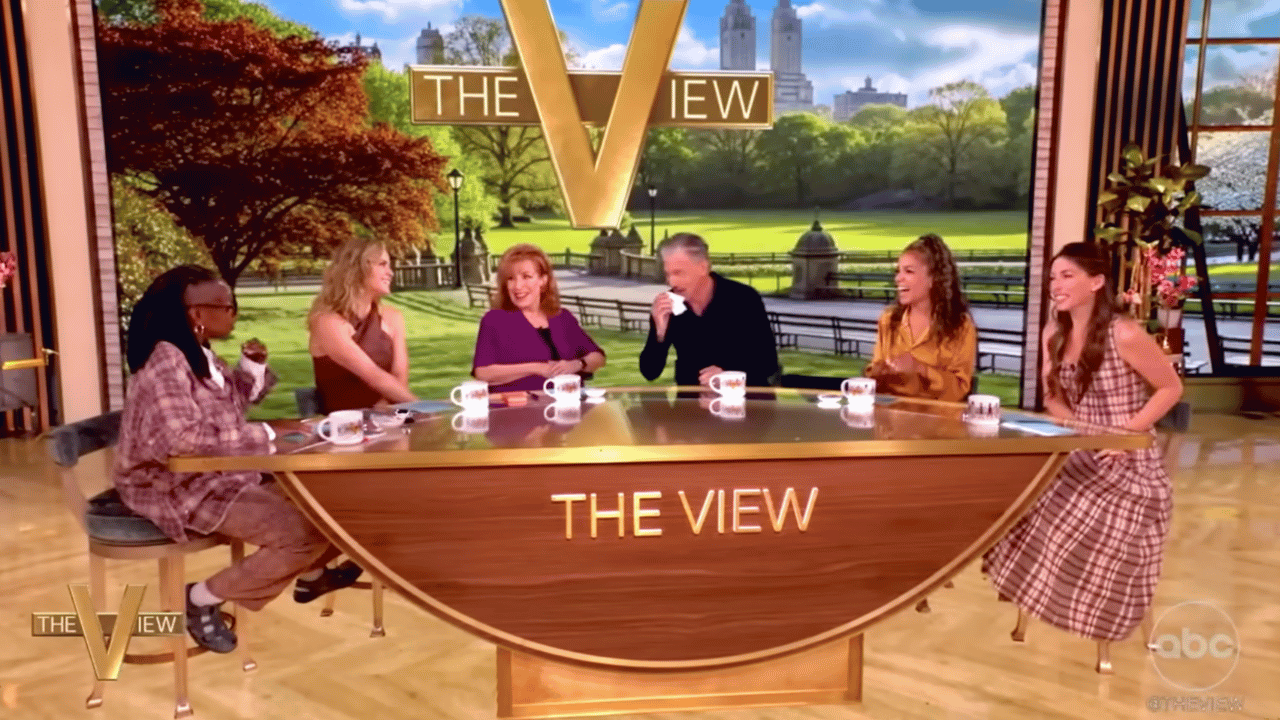 Joy Behar pulled Anson Mount in for a kiss on the lips.