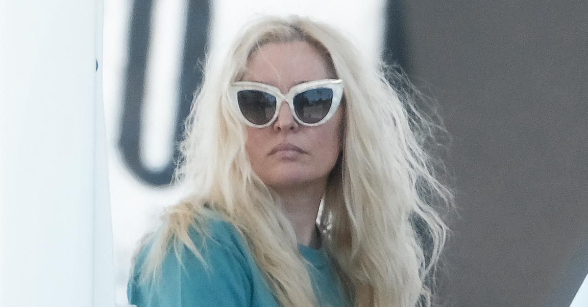 erika jayne photos unrecognizable explosive rhobh dinner holding atm card embezzelement investigation