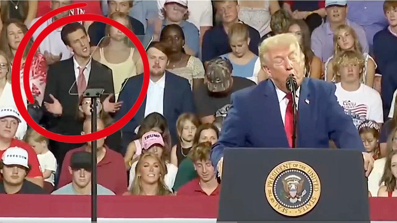 A man in a black suit mimicked the president's hand gestures.