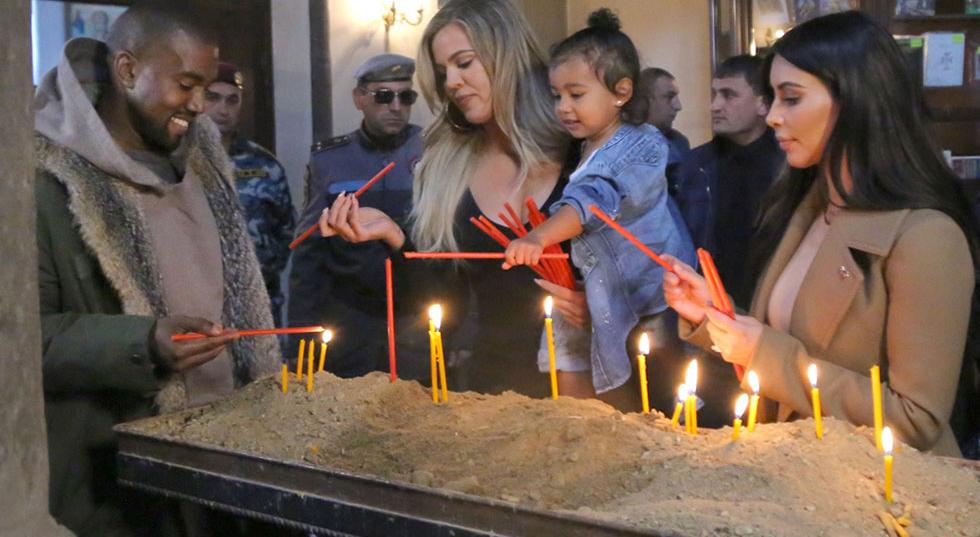 Kim & Khloe Kardashian Light A Candle In Armenia With North West
