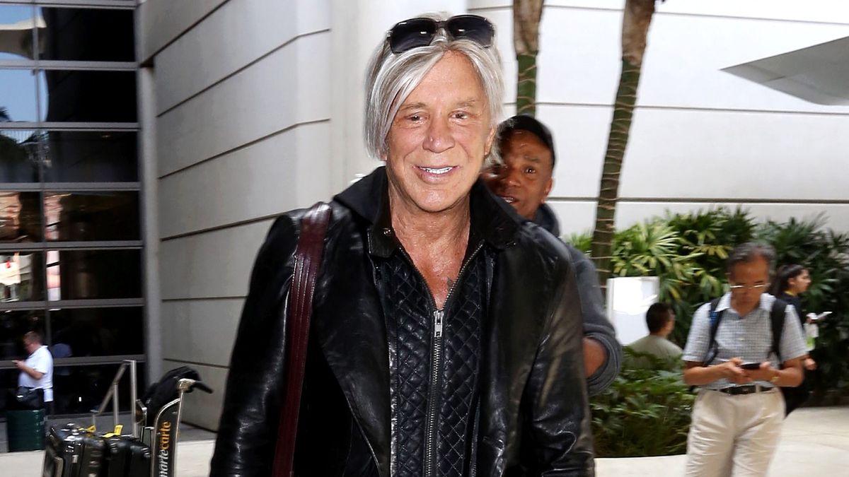 Mickey Rourke has been removed from his home after a defiant standoff with mounting issues.