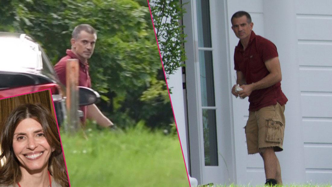 Fotis Dulos standing in front of the house