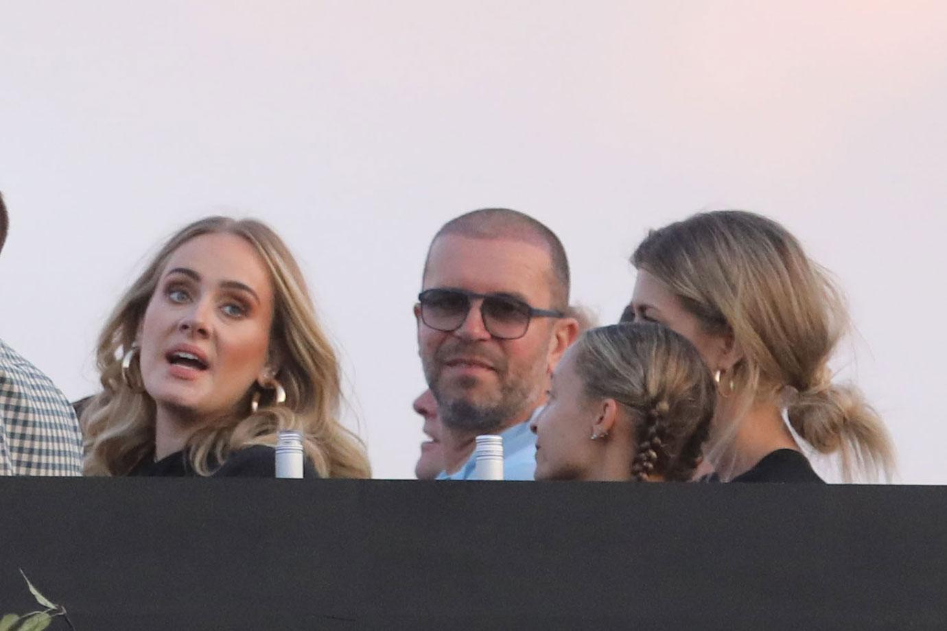 A happy and smiling Adele shows off her slimmer figure at a Celine Dion concert in Hyde Park, London