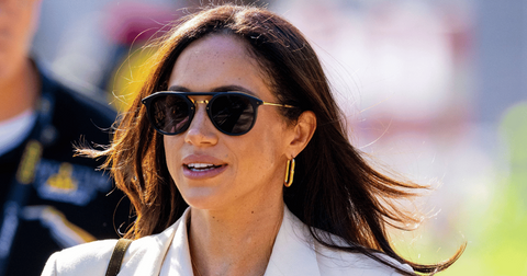Photo of Meghan Markle wearing sunglasses at official event.