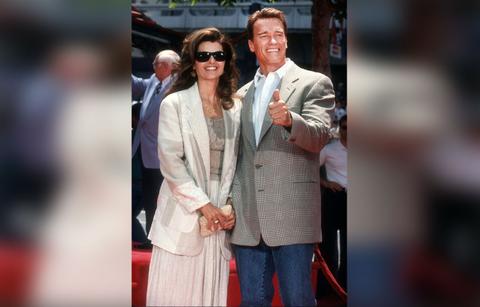 arnold schwarzenegger looks glum photos riding bike male friend maria shriver divorce settlement millions
