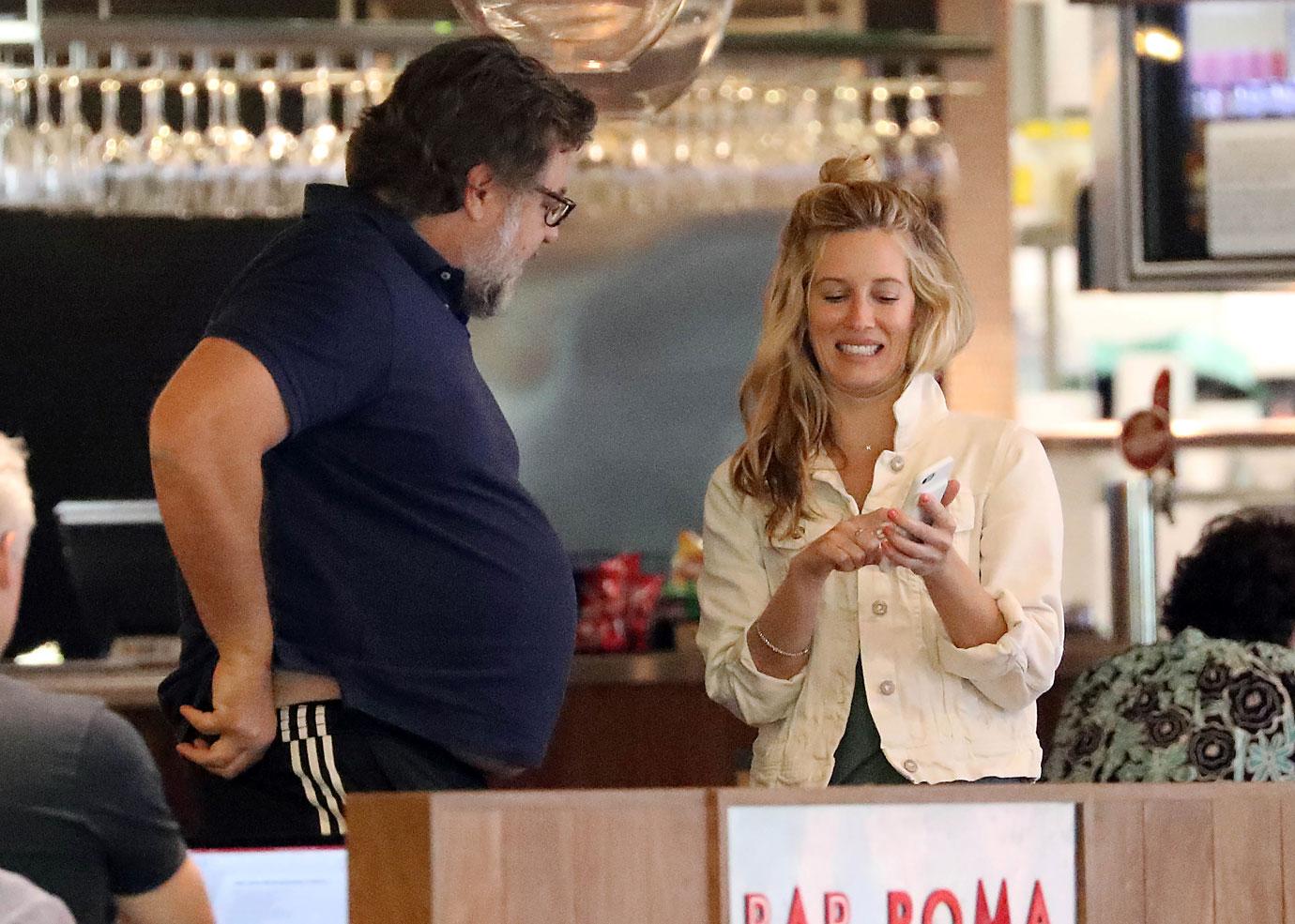 Russell Crowe Shows Off Weight Gain While With New Assistant