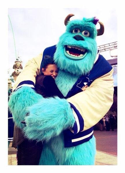 Demi Lovato hang fun hugging one of the monsters from