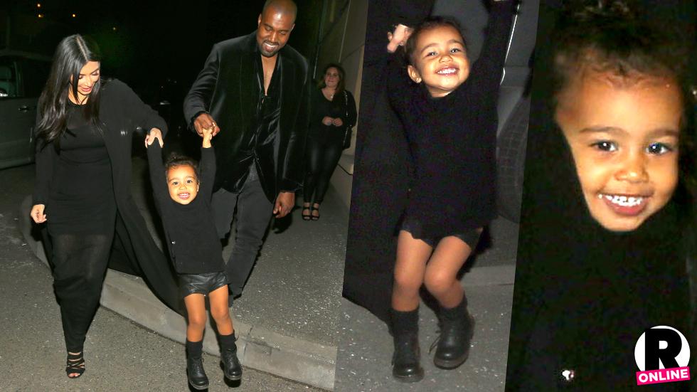 She DOES Smile! North West Grins As She Swings From Kim Kardashian ...
