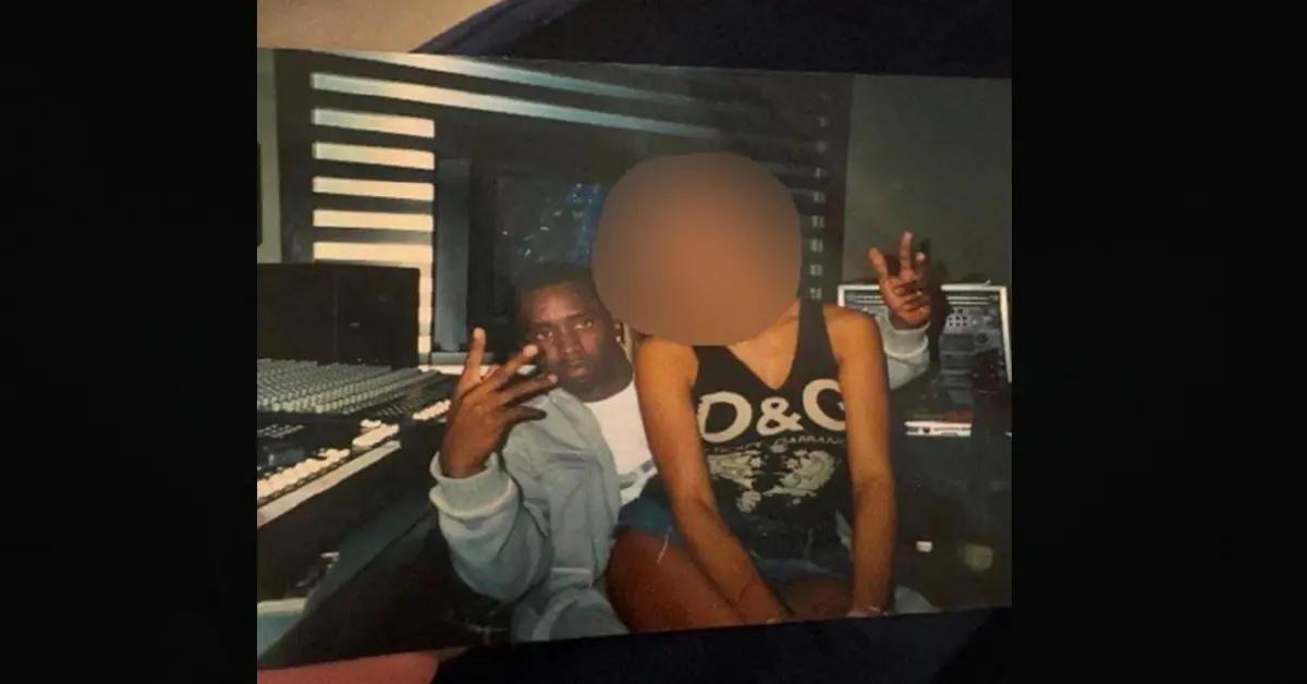 sean diddy combs with victim sitting on lap