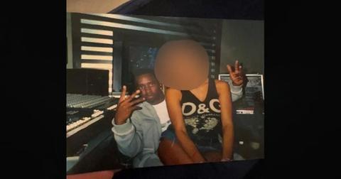 sean diddy combs with victim sitting on lap