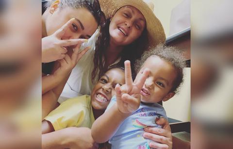 Briana Dejesus' grandmother poses for a photo with her grandchildren.