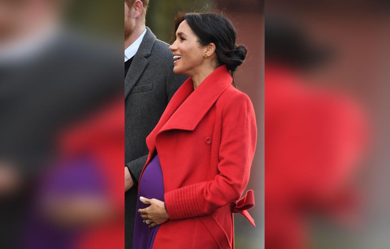 Meghan Markle Shows Baby Bump In Purple Dress & Red Coat