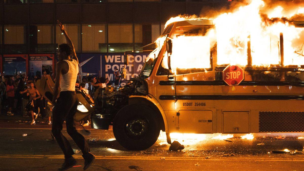 A photo of a bus lit on fire