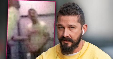 Shia LaBeouf With Full BeardWalking Down the Street Wearng AirBuds and Yellow Sweatshirt, Inset Shia LaBeouf Ranting at Bar