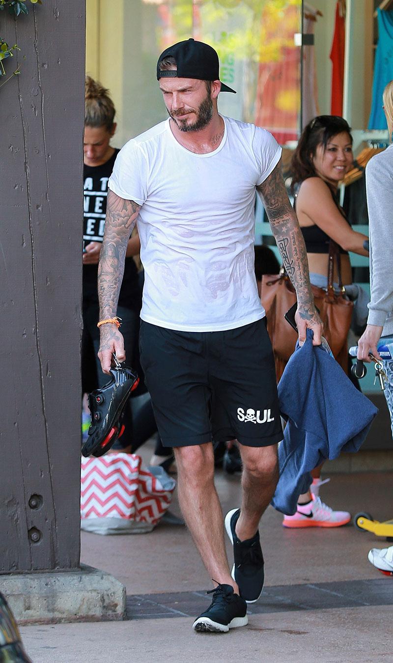 David Beckham layers sporty shorts over compression leggings at SoulCycle  in Los Angeles