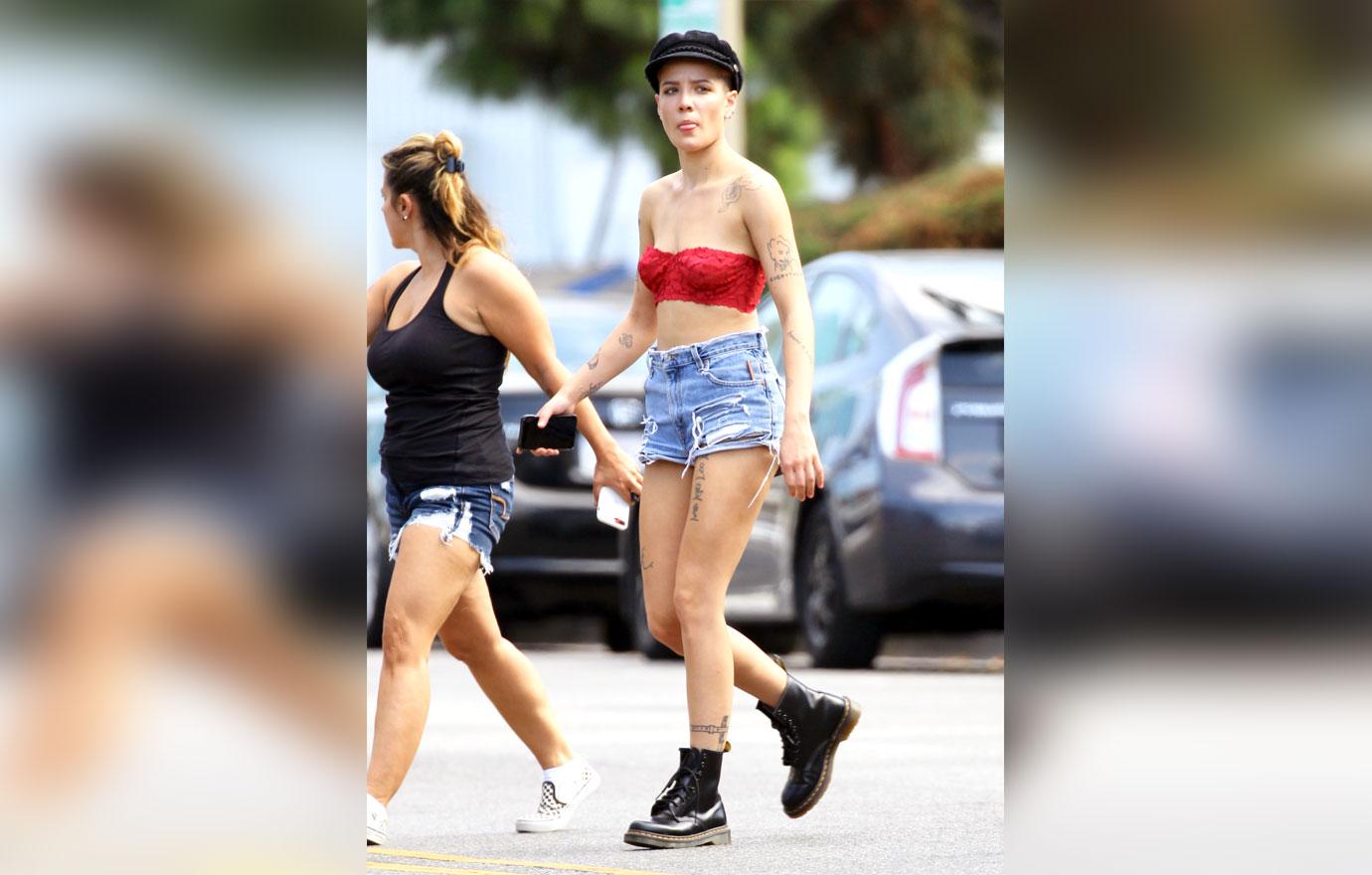 //halsey spotted wearing lace bra and daisy dukes