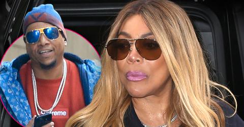 Inset Kevin Hunter Wearing Chains Around His Neck, Sunglasses, Blue And Red Hat, Red Supreme Shirt And Blue LV Parka, Wendy Williams Looking Sad Wearing Pink Lipstick, Sunglasses And Black T-Shirt