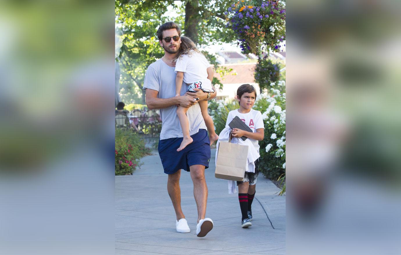 Scott disick carries sleepy penelope family dinner